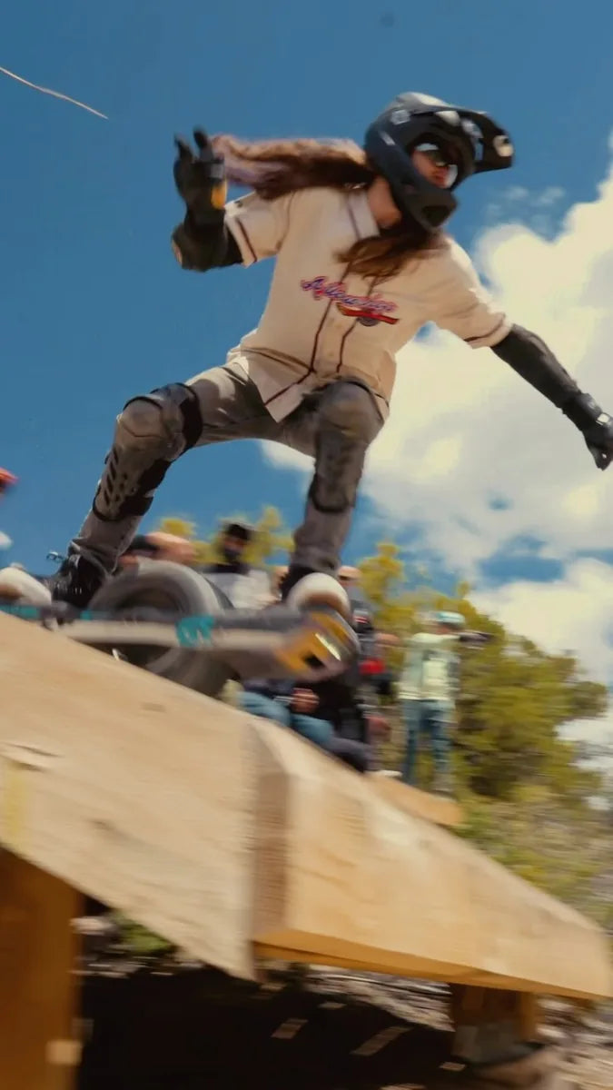 Aaron Kidd dropping onto a ramp on his Onewheel.