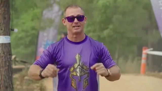 Bart Miller speaking at an outdoor Onewheel event.