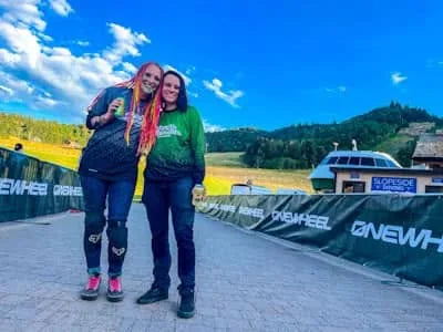 Racheal Cecil and Jaymie Bryant together at Snowbasin Resort during a Onewheel race event.