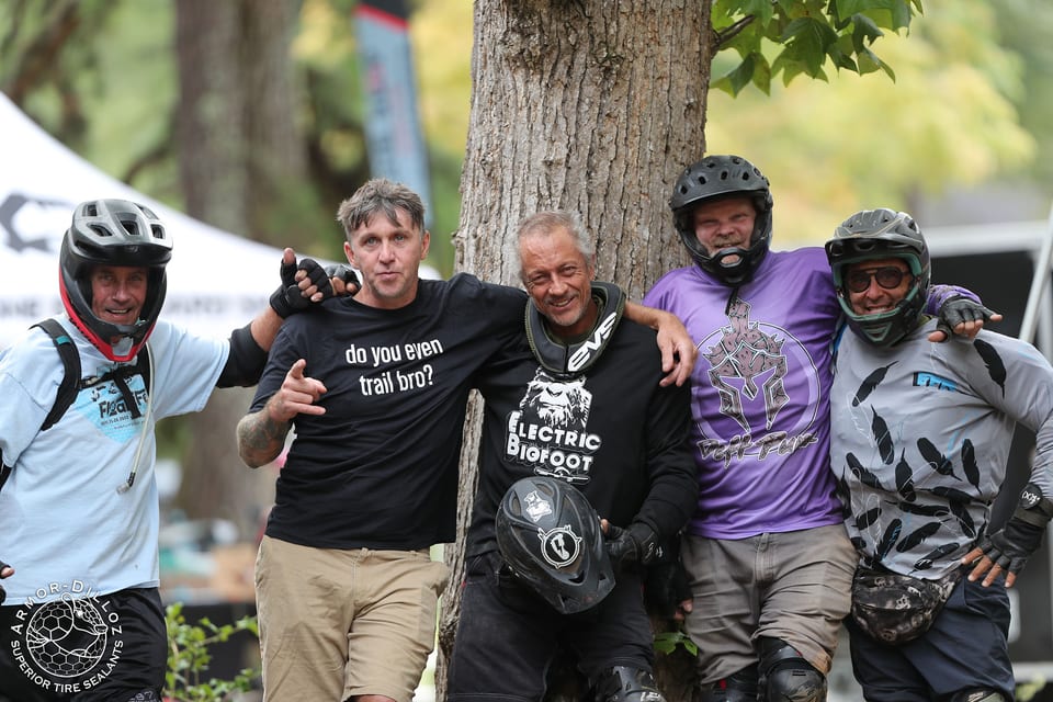 Five riders stand arm in arm at Floatlife Fest 7.