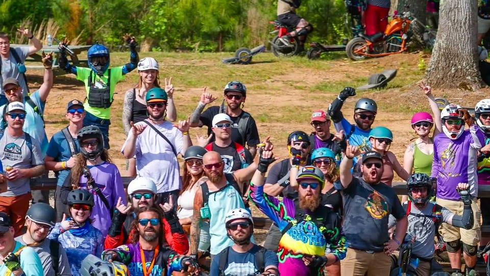 Oak City riders gathered in the main-group video still.